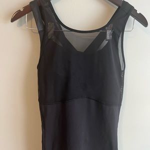 All black open back Lululemon top with bra inside